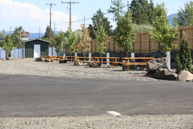 Row of RV sites with picnic tables and trees